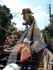 Track panel being laid by a crane.