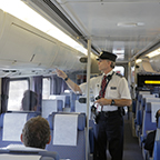 Conductor placing a seat check, 2015.