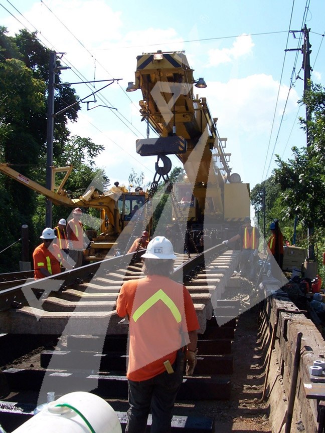 Track panel being laid by a crane.