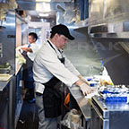 Chef preparing lunch on the <i>Silver Meteor</i>, 2015.