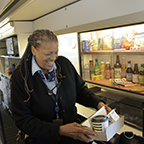 Lead service attendant helping a customer, 2015.