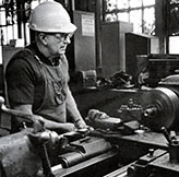 Machinist making brass nuts at Beech Grove, 1980.