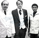 Employees modeling new uniforms, 1977.