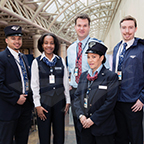 Onboard and Station Services employees modeling uniforms, 2014.