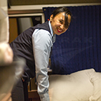 Sleeping car attendant making up beds, 2016.