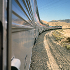 Western long-distance train in a desert landscape, 1980s.