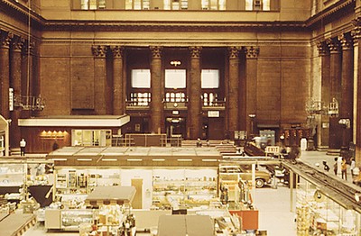 Amtrak consolidated all Chicago-area services at Union Station in 1972. This 1974 image shows the main hall populated by various displays as well as passenger seating. Image by Charles O'Rear, courtesy of the National Archives.